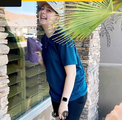 A man about to do interior and exterior window cleaning